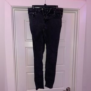 Skinny distressed black jeans.